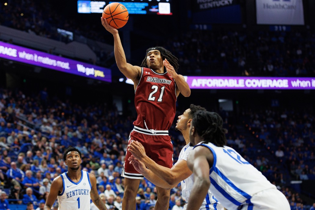Nov 6, 2023; Lexington, Kentucky, USA; New Mexico State Aggies forward Robert Carpenter (21) goes to the basket during the first half against the Kentucky Wildcats at Rupp Arena at Central Bank Center.